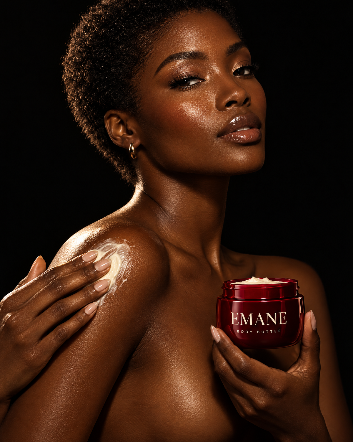 Woman applying EMANE Red Heart body butter